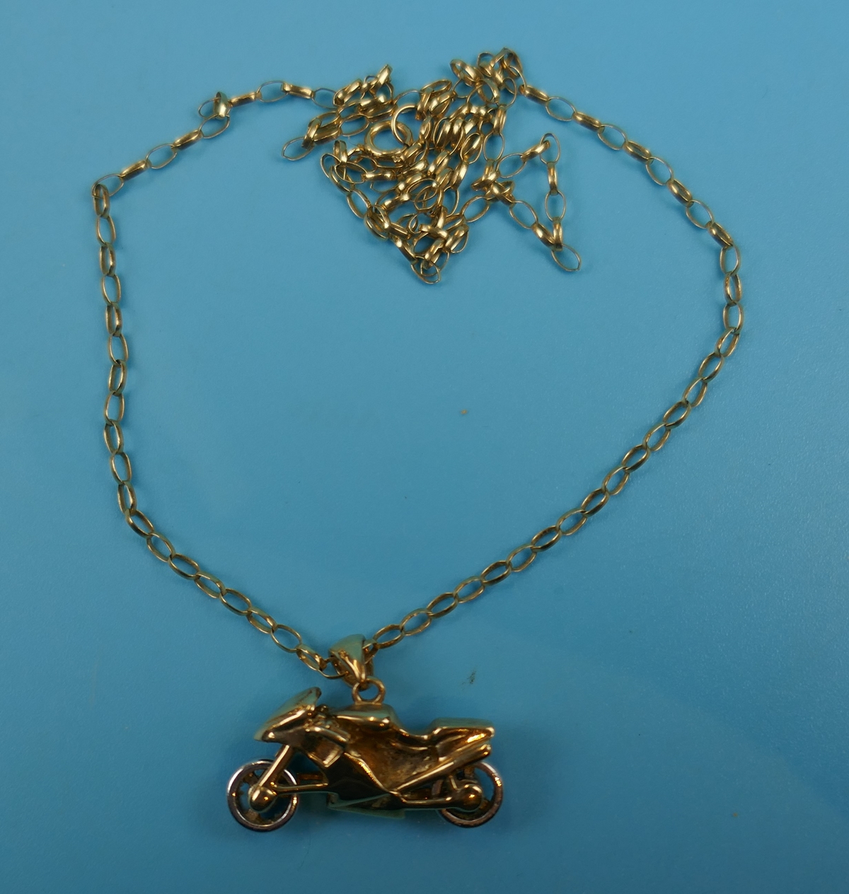 Hallmarked gold motorbike pendant on gold chain