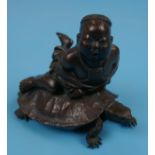 Small signed Oriental bronze of boy riding tortoise