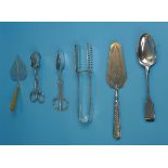 Collection of white metal utensils
