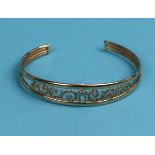 Gold blue topaz set bangle