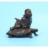 Small bronze signed figure of boy on turtle