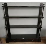 Ebonised wall shelves