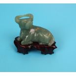 Small green jade bull on stand