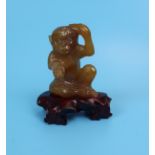 Honey jade figure of monkey on stand
