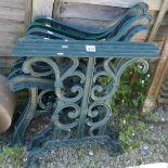 2 sets of cast bench ends together with matching table ends