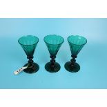 Trio of green regency wine glasses