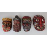 4 carved and polychrome tribal masks to include Japanese & Indian Buddhist