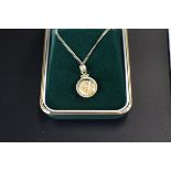 Gold pendant containing gold flakes on gold chain with COA