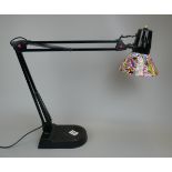 Angle poise style lamp with retro sticker bomb shade