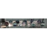 Collection of 10 Caithness glass paperweights with stands and COA's