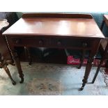 Antique mahogany side table on casters