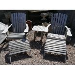 Pair of teak loungers with leg rests and table