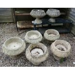 Set of 7 pedestal stone planters