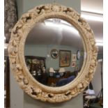 Convex mirror in ornate frame