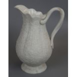 Mid 19thC small moulded Bisque jug with floral decoration and dual twist handle