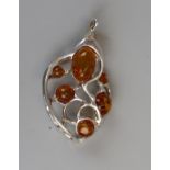 Unusual silver & amber pendant