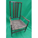 Antique slat back rush seated armchair
