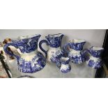 5 graduated Ironstone blue & white jugs