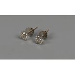 Pair of 18ct white gold ½ct diamond stud earrings