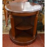 Unusual mahogany revolving table with shelving to base