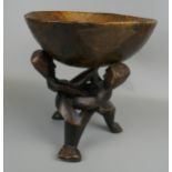 Carved tribal bowl on stand