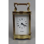 Brass clock by Woodford