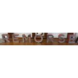 Metal letters spelling REMORSE - Approx H: 10cm