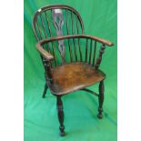 Antique elm seated stick back armchair with crinoline stretcher
