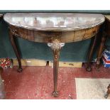 Mahogany demi lune hall table on ball and claw feet