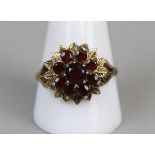 Gold garnet set ring (size V)