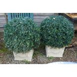 Pair of square stone planters with artificial trees