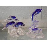2 glass dolphin figures