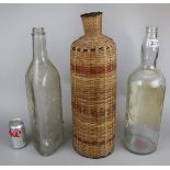 2 large whisky bottles to include wicker cover