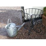 Metal plant stand together with galvanised watering can