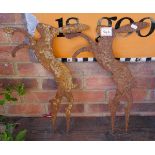 Pair of rusty silhouette boxing hares
