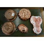 5 jelly moulds to include copper examples