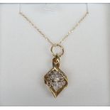 Gold diamond set pendant on chain
