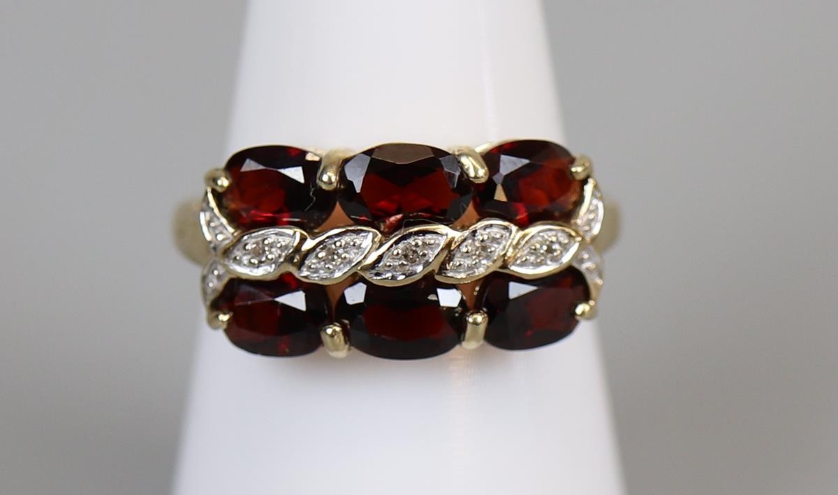 Gold garnet & diamond set ring (size M½)