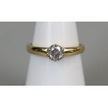 18ct gold diamond solitaire ring (size K½)