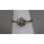 18ct gold diamond daisy ring with platinum setting (size M¼)