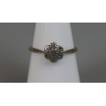 18ct gold diamond daisy ring (size N½)