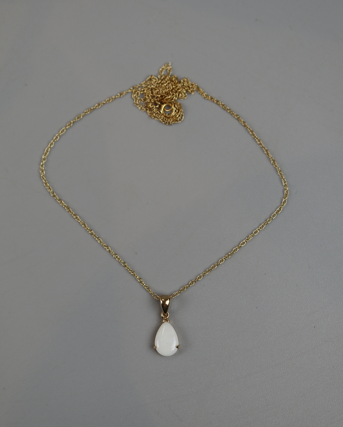 Gold opal pendant on gold chain