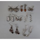 8 pairs of silver earrings