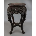 Oriental carved pot stand with marble inset