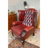 Leather ox blood wing-back armchair