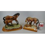 2 ceramic horse figures on wooden bases