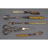 2 silver bladed butter knives, grape scissors, pickle fork & cheese scoop