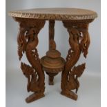 Ornately carved Chinese tripod table