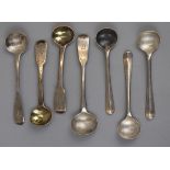 7 silver condiment ladles, mostly Georgian