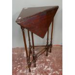 Unusual antique mahogany fold out occasional table